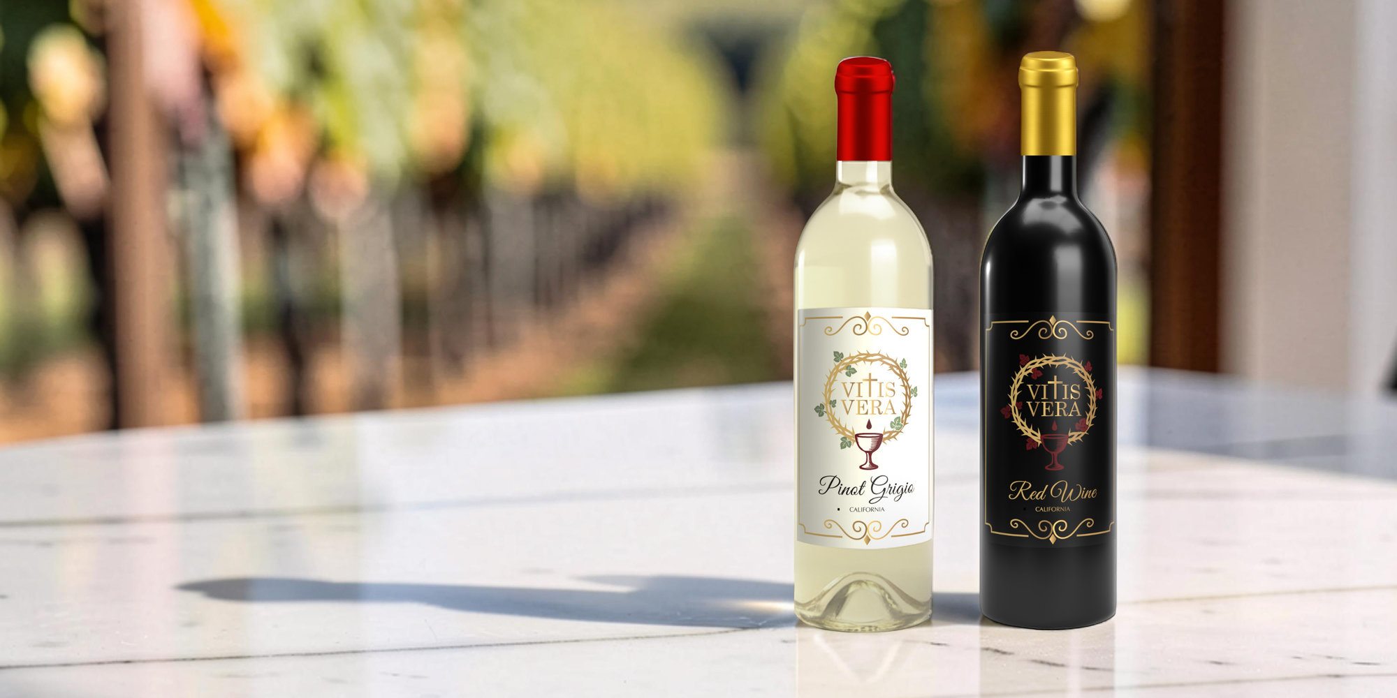 Vitis Vera Pinot Grigio and Vitis Vera Red Wine bottles on white marble table in front of wine vineyard